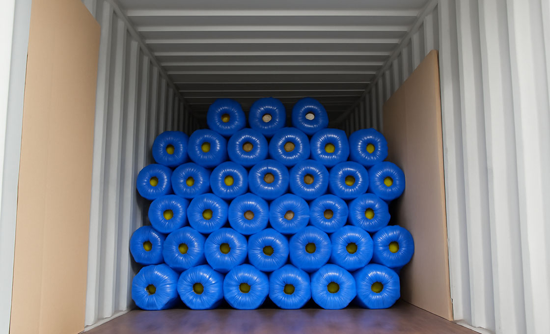 Various artificial turf models loaded efficiently in a shipping container